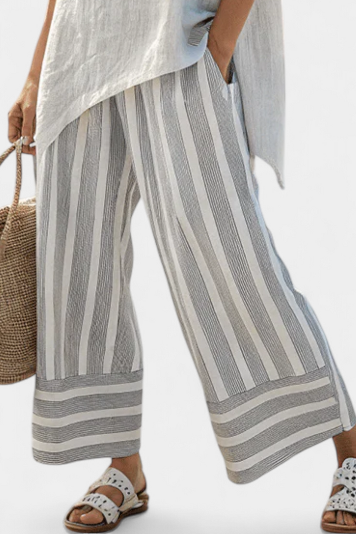 Fiorella – blusa asimétrica elegante y pantalones a rayas